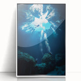 Framed acrylic artwork showcasing a stunning landscape of caves, featuring vibrant colors and intricate details, presented in a sleek white frame for modern decor.