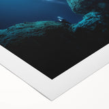 Rolled canvas depicting a vibrant cave landscape with rich colors and intricate details, ideal for home decor, presented in a protective cardboard tube.