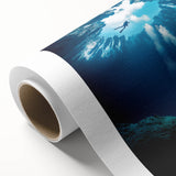 Rolled canvas artwork showcasing a vibrant landscape scene with intricate cave formations, wrapped in protective cardboard for safe shipping and display.