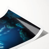 Vibrant rolled print showcasing a stunning landscape with dramatic caves, featuring rich colors and intricate details, perfect for home decor or art enthusiasts.