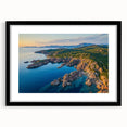 Framed landscape artwork showcasing dramatic cliffs against a serene sky, featuring a sleek black mat and frame for a modern aesthetic, ideal for home decor.