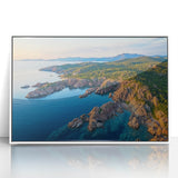 Framed acrylic artwork showcasing a vibrant landscape of cliffs against a clear blue sky, perfect for enhancing modern home decor with nature-inspired aesthetics.