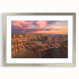 Framed landscape artwork showcasing vibrant canyons in rich colors, featuring a silver mat and frame, ideal for enhancing modern home decor.