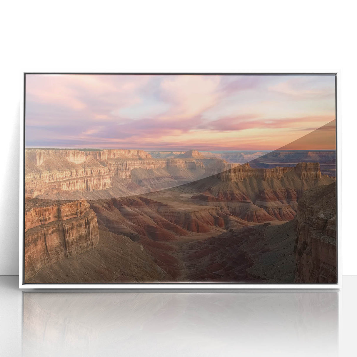 Framed acrylic artwork depicting a vibrant landscape of canyons in earthy tones, set against a sleek white frame, perfect for modern decor enthusiasts.