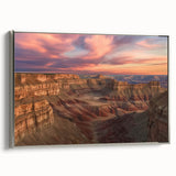 Framed canvas artwork showcasing a stunning landscape of canyons, featuring rich earth tones and intricate details, presented with a sleek silver frame side view. Perfect for enhancing modern decor in living spaces or offices.