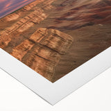 Vibrant landscape canvas print showcasing majestic canyons in warm earth tones, rolled for delivery, perfect for home decor or office spaces.