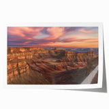 Landscape print showcasing vibrant canyons in warm earth tones, rolled for easy shipping and display. Perfect for enhancing home decor with natural beauty.