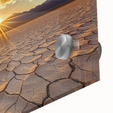 Close-up of a vibrant acrylic landscape artwork depicting a desert scene, showcasing warm hues of orange and yellow against a clear blue sky, perfect for home decor.