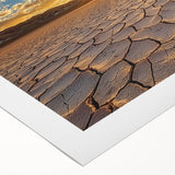 Desert landscape rolled canvas wall art showcasing vibrant hues of orange and yellow with textured details, elegantly packaged in a protective cardboard tube.