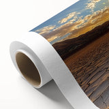 Desert landscape rolled canvas art showcasing vibrant hues of orange and yellow, depicting a serene sunset over sand dunes, ideal for home decor.