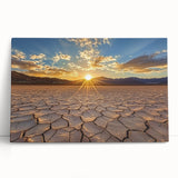 Stretched canvas artwork depicting a vibrant desert landscape with warm hues of orange and yellow, leaning against a neutral wall, showcasing a serene natural scene perfect for home decor.