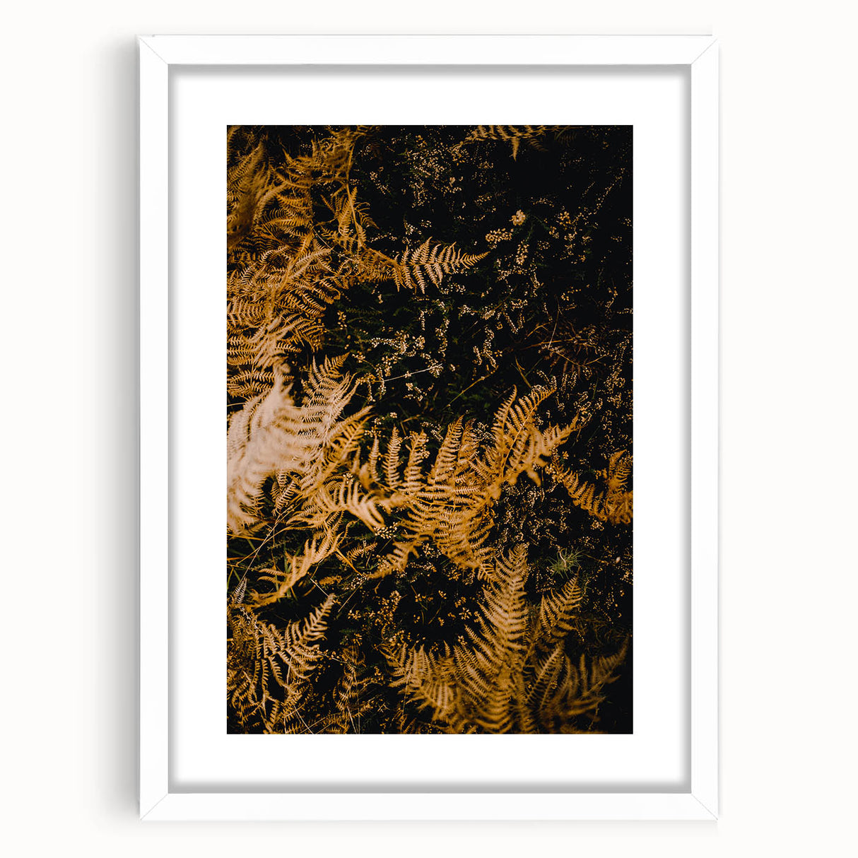 Abstract art print depicting swirling autumn hues on a white framed canvas, suitable for dining room or bedroom decor.