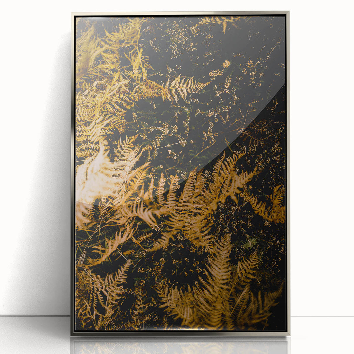 Mid-century modernist art depicting autumn trees in orange and brown tones on a silver-framed acrylic print.