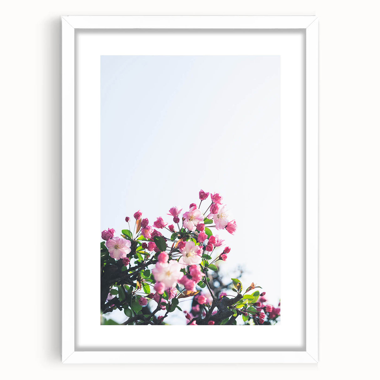 Abstract art print featuring swirling spring colors in pastel shades, framed with a white mat, ideal for dining room decor.