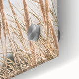 Large abstract wall art in vibrant orange and yellow tones on acrylic glass.