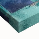 Close-up view of a stretched canvas showcasing abstract strokes in vibrant colors, perfect for modern home decor, emphasizing artistic texture and design elements.