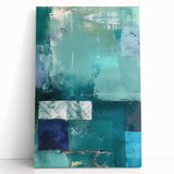 Abstract canvas wall art featuring vibrant strokes in shades of blue, orange, and yellow, leaning against a textured wall, perfect for modern home decor.