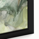 Close-up of a framed abstract wall art piece showcasing vibrant strokes in shades of blue, orange, and yellow, perfect for modern home decor.