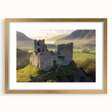 Elegant gold-framed landscape artwork depicting a serene castle scene, enhanced by a stylish mat. Ideal for home decor or gallery display, this piece adds a touch of sophistication.