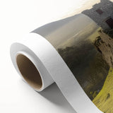 Rolled canvas print showcasing a vibrant landscape featuring a majestic castle nestled among lush greenery, perfect for home decor. The artwork is elegantly packaged for safe delivery.