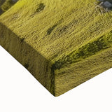 Close-up of a stretched canvas showcasing a vibrant landscape featuring a majestic castle surrounded by lush greenery, ideal for enhancing home decor with artistic elegance.