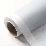 Rolled canvas artwork showcasing a vibrant landscape design featuring a rustic barn, with rich colors and textures, securely packaged in a protective cardboard tube.