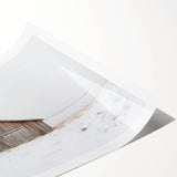 Rustic landscape barn print rolled up in a protective tube, showcasing vibrant colors and intricate details, ideal for farmhouse decor enthusiasts.