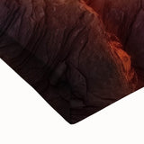 Close-up of a stretched canvas artwork depicting a vibrant landscape of canyons at sunset, showcasing rich colors and intricate textures that enhance any decor.