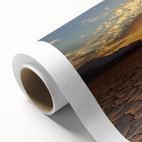Rolled canvas depicting a vibrant desert landscape with warm tones of orange and gold, showcasing unique textures, perfect for home decor or art lovers.