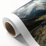 Vibrant rolled canvas showcasing a serene landscape with lush green fields under a clear blue sky, elegantly packaged in a protective cardboard tube. Ideal for home decor.