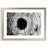 Textured art print featuring abstract nature elements in muted earth tones, framed in silver, ideal for bedroom art.