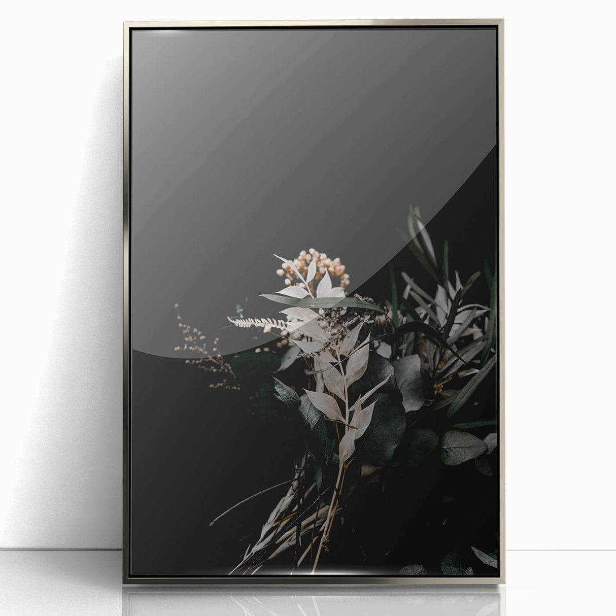 Mid-century modernist art depicting fall trees in orange and yellow on a silver framed acrylic print.