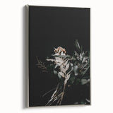 Framed canvas depicting a vintage landscape art painting with colorful autumn trees and a black background.