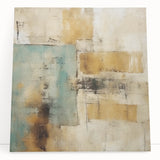 Colorful abstract strokes wall art design on a stretched canvas, leaning against a neutral wall, showcasing vibrant hues of blue, orange, and yellow for modern decor.