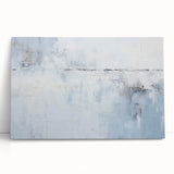 Abstract wall art on stretched canvas featuring vibrant strokes in shades of blue, orange, and yellow, leaning against a neutral wall, adding a modern touch to any decor.