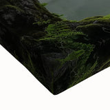 Close-up of a stretched canvas print showcasing a vibrant landscape of a majestic castle surrounded by lush greenery, perfect for home decor.