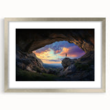 Framed landscape artwork depicting a serene cave scene, featuring a silver mat and elegant frame, perfect for enhancing modern home decor and adding a touch of nature-inspired elegance.