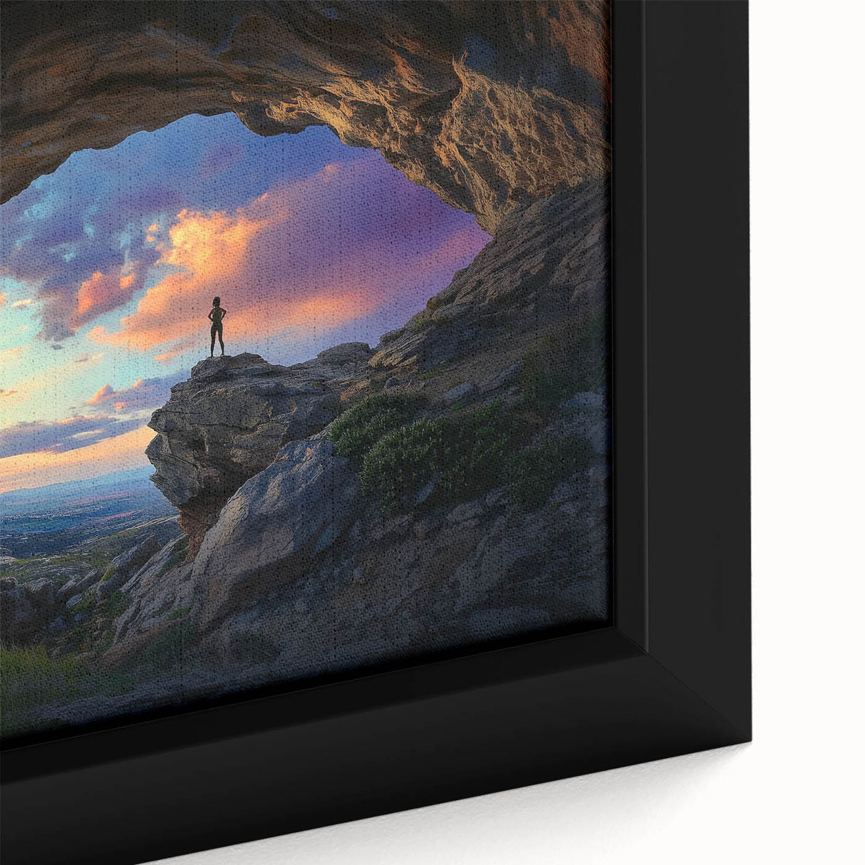 Close-up of a framed canvas artwork depicting a vibrant landscape with intricate cave formations, showcasing earthy tones and detailed textures, ideal for home decor.