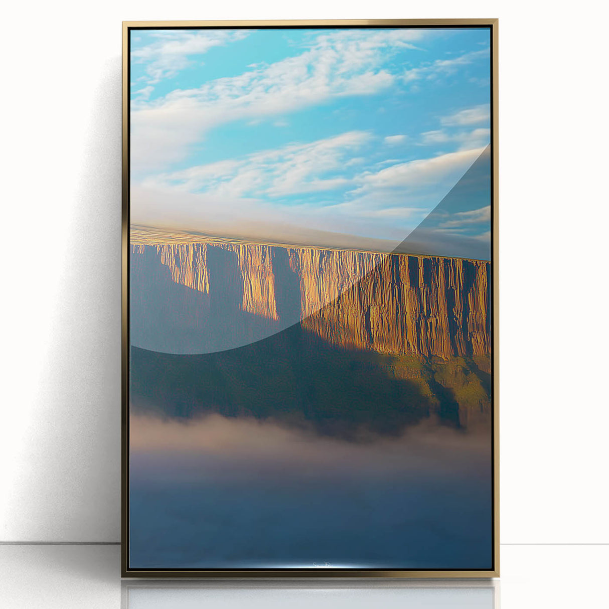 Framed acrylic landscape artwork showcasing dramatic cliffs with a gold border, perfect for adding a touch of elegance to modern home decor.
