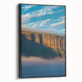 Framed canvas artwork showcasing a stunning cliff landscape with vibrant colors and intricate details, displayed in a sleek black frame. Perfect for enhancing modern home decor.