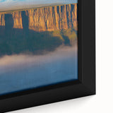 Close-up of a framed canvas showcasing a vibrant landscape scene with dramatic cliffs and lush greenery, perfect for home decor and nature enthusiasts.