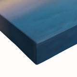 Close-up of a stretched canvas depicting a vibrant landscape of cliffs and rocky formations, showcasing rich colors and intricate details for home decor.