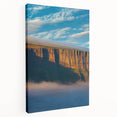 Stretched canvas artwork depicting a breathtaking side view of dramatic cliffs, showcasing earthy tones and intricate textures, perfect for enhancing any landscape-themed decor.