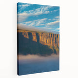 Stretched canvas artwork depicting a breathtaking side view of dramatic cliffs, showcasing earthy tones and intricate textures, perfect for enhancing any landscape-themed decor.