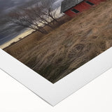 Rolled canvas showcasing a vibrant landscape design with a rustic barn, featuring rich colors and textures, perfect for home decor display or art collection.