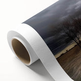 Rolled canvas print showcasing a vibrant landscape design featuring a rustic barn surrounded by lush greenery, elegantly packaged in a protective cardboard tube for easy transport and storage.