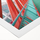 Rolled canvas artwork showcasing a vibrant landscape bridge design, featuring lush greenery and a serene river scene, neatly packaged in a protective cardboard tube.