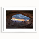 Framed landscape artwork of canyons with a white mat, showcasing earthy tones and intricate details, perfect for home decor or office aesthetics.