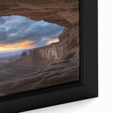 Close-up of a framed canvas print showcasing a stunning landscape of canyons, highlighting rich earth tones and intricate details that evoke a sense of adventure. Ideal for home decor, this artwork adds a touch of nature-inspired elegance to any space.