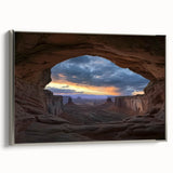 Framed canvas artwork depicting a stunning landscape of canyons, showcasing vibrant colors and intricate details, with a sleek silver frame enhancing its elegance.
